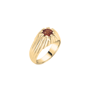 Gold ring with a red gemstone on a white background