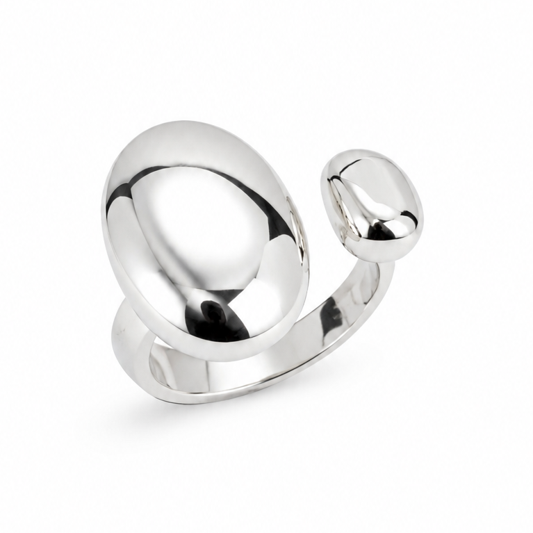 A polished silver-toned ring with a large rounded oval shape and a smaller rounded protruding section, photographed on a clean white background.