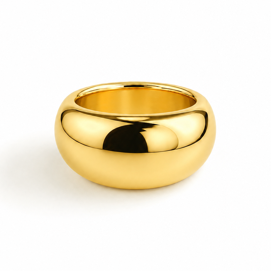 A polished, dome-shaped gold ring with a smooth, reflective surface, shown on a clean white background.